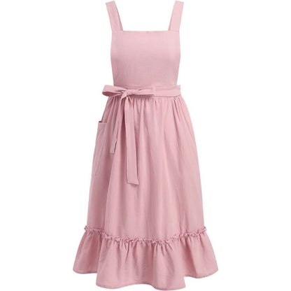 Pink garden apron with ruffled hem and waist ties on a white background