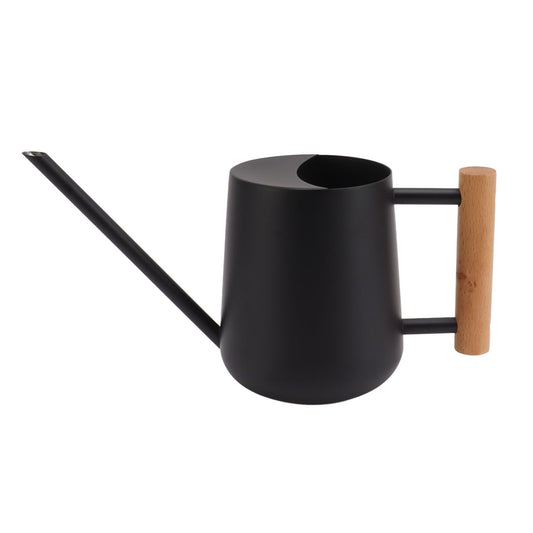 Black watering can with long spout and wooden handle on a white background
