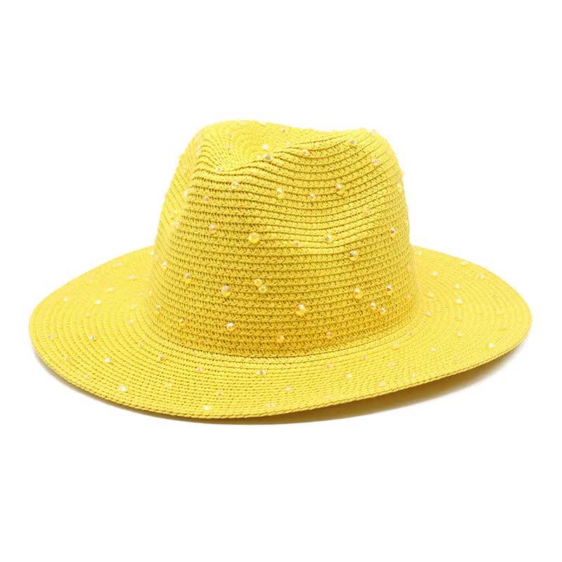Yellow wide brim straw hat with rhinestones on a white background