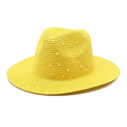 Yellow wide brim straw hat with rhinestones on a white background