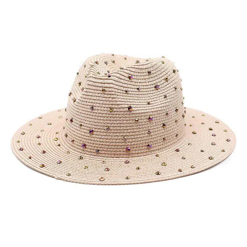 Pink wide brim straw hat with rhinestones on a white background