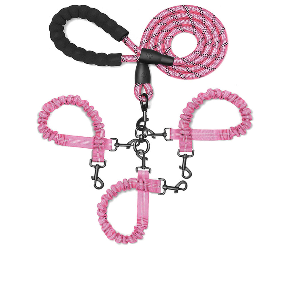 Pink three-way dog lead, padded handle, bungee couplers and three clips, laid flat