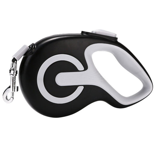 Black retractable dog lead with anti slip grip on a white background