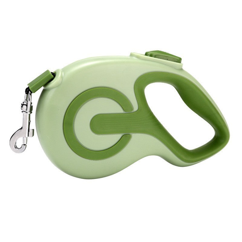 Green retractable dog lead with anti slip grip on a white background