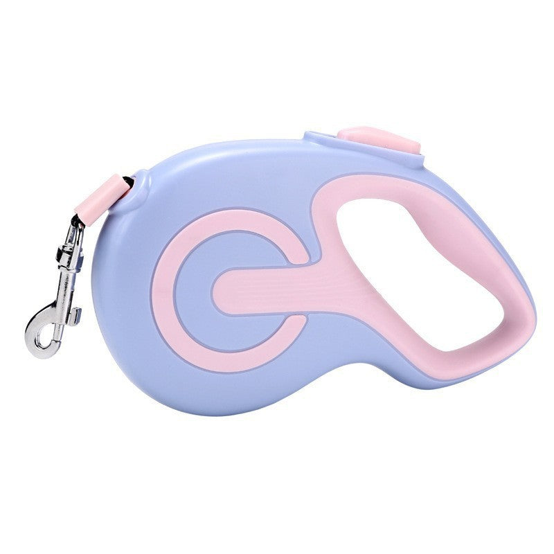 Purple retractable dog lead with anti slip grip on a white background